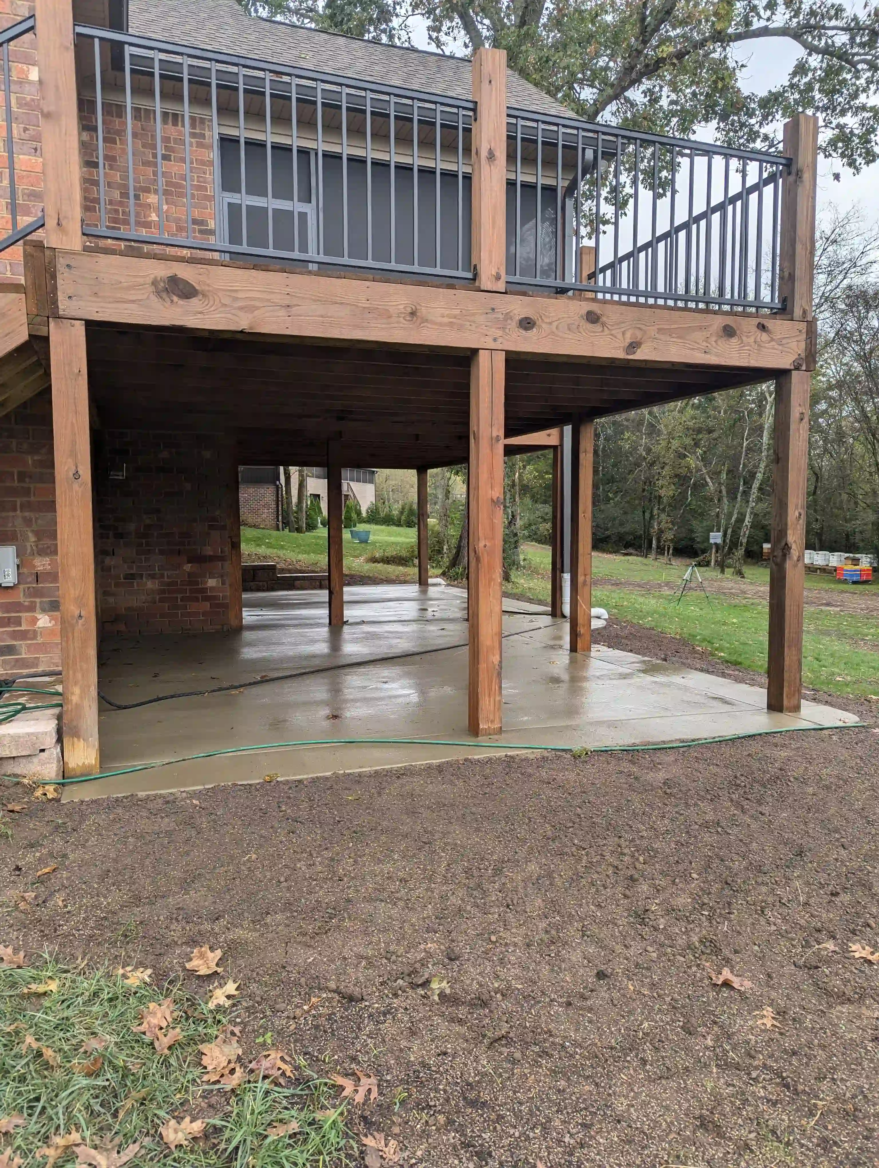 finished concrete underneath a wooden porch