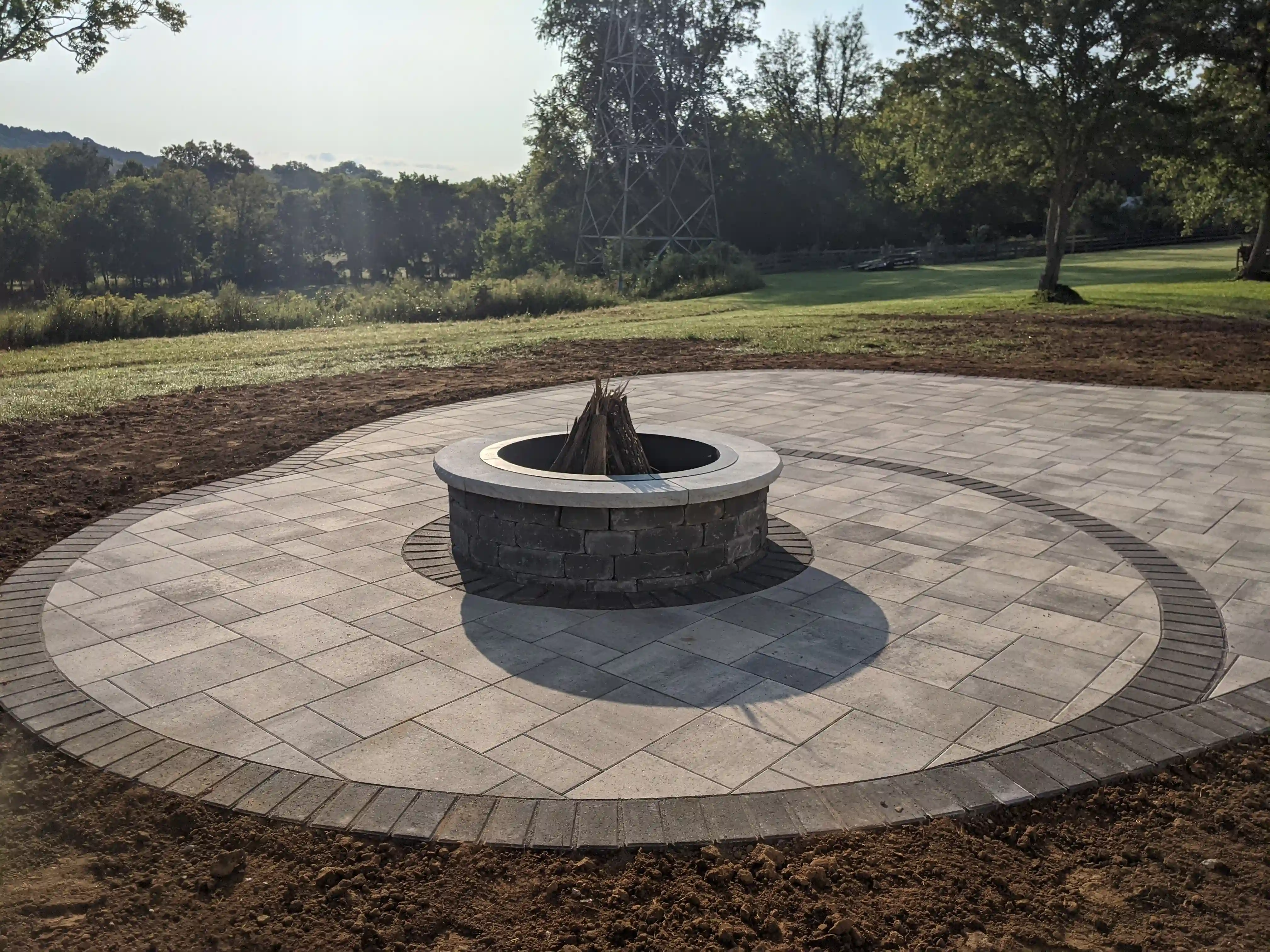Outdoor stone firepit with flames burning