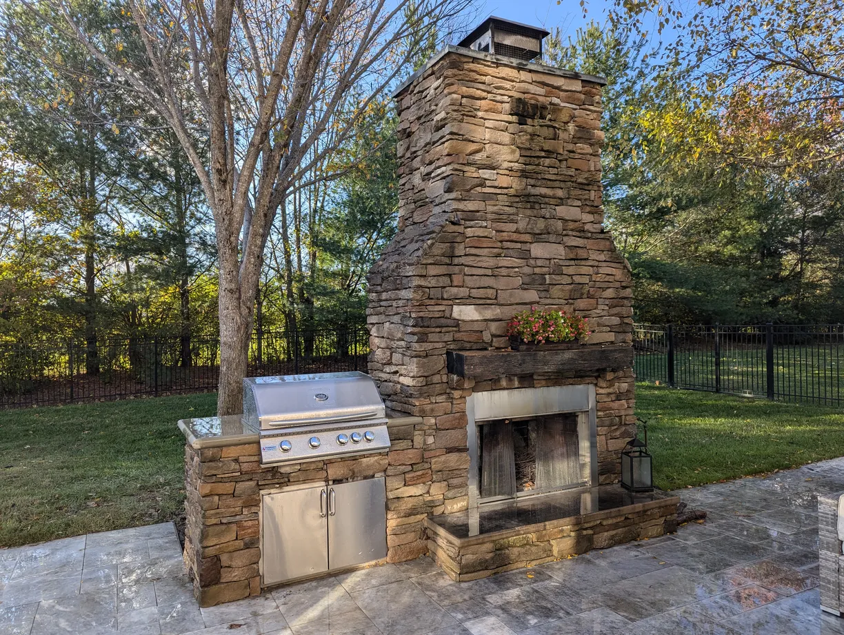 Large outdoor fireplace with roaring fire