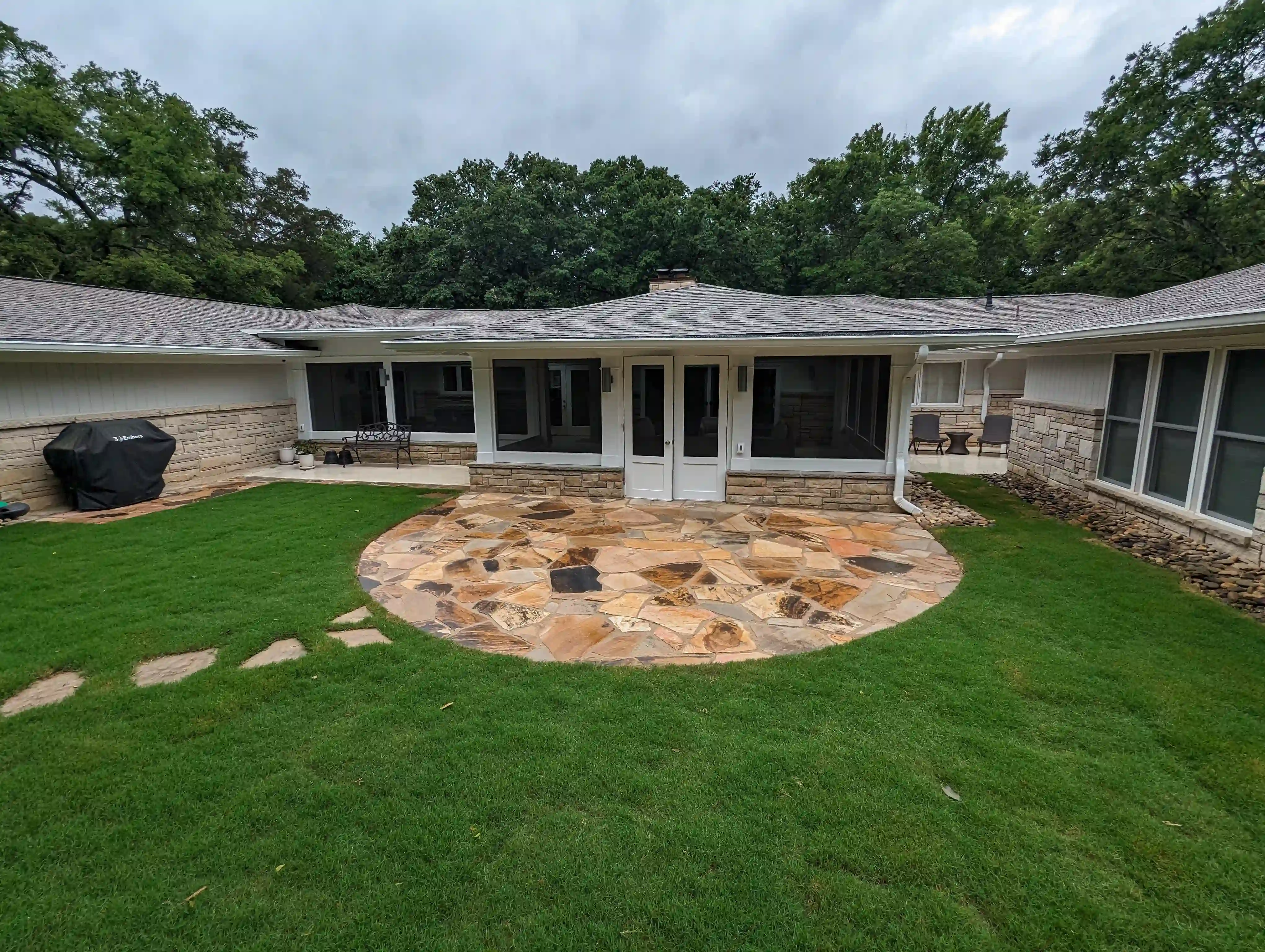 a rounded flagstone patio with very large flagstone rocks