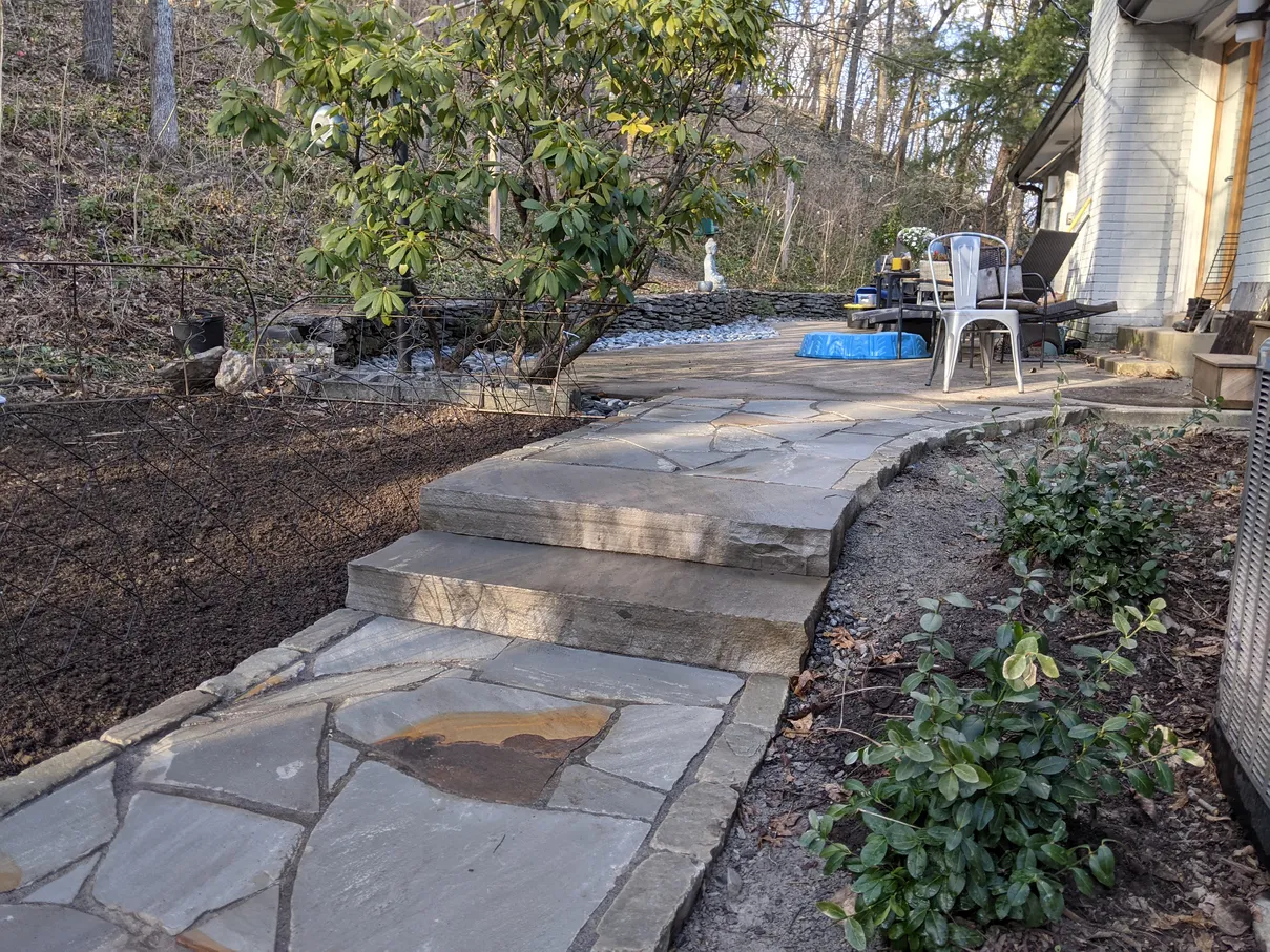 large flagstones used to create a pathway in a backyard