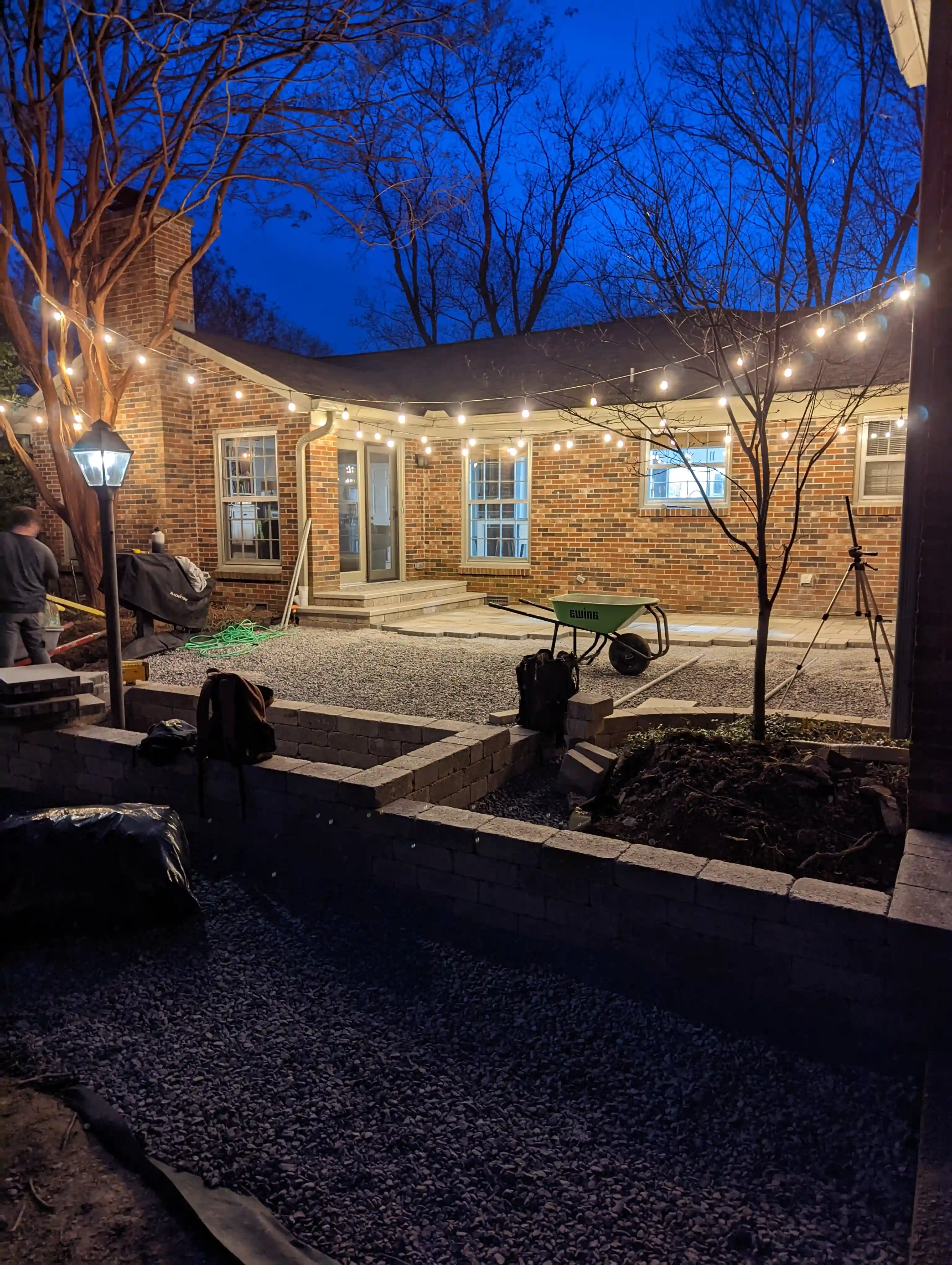Subtle deck lighting creating ambiance in an upscale backyard