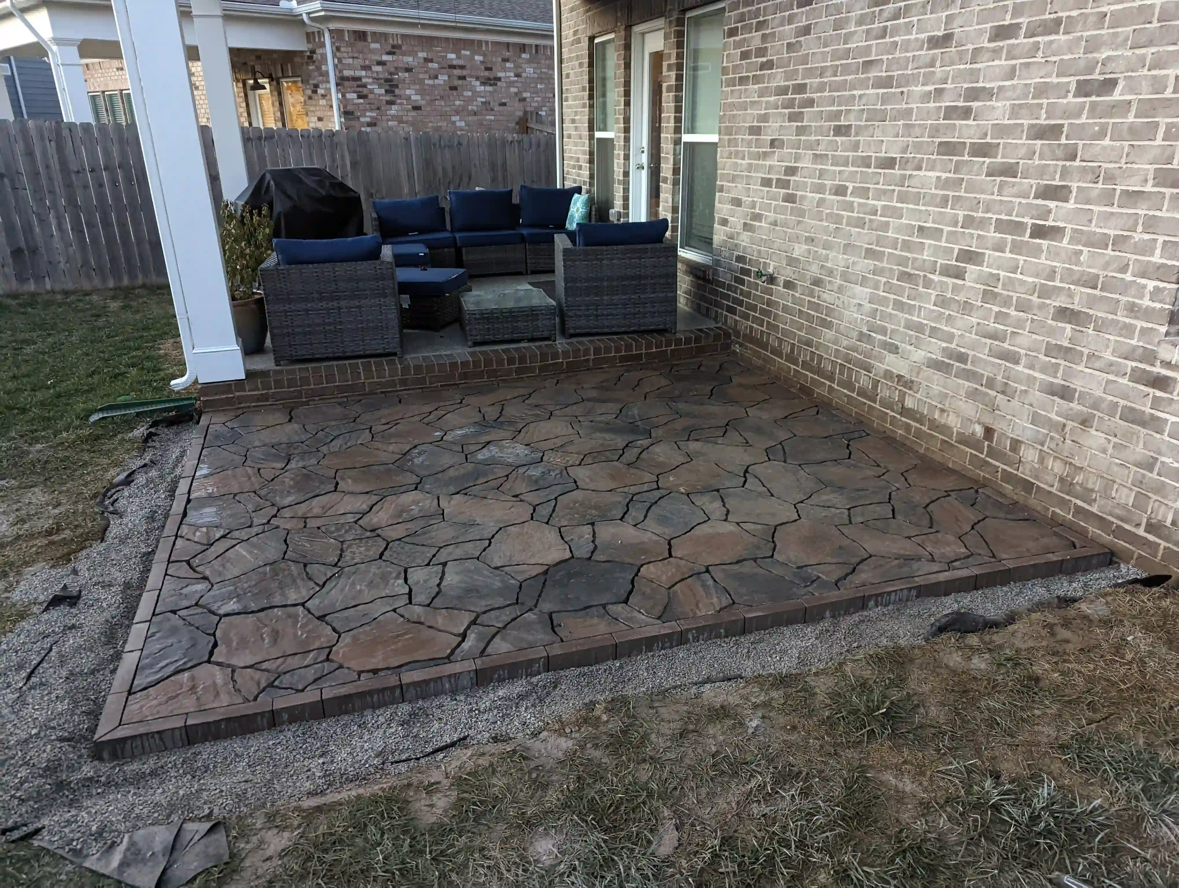natural river stone paver patio in the backyard