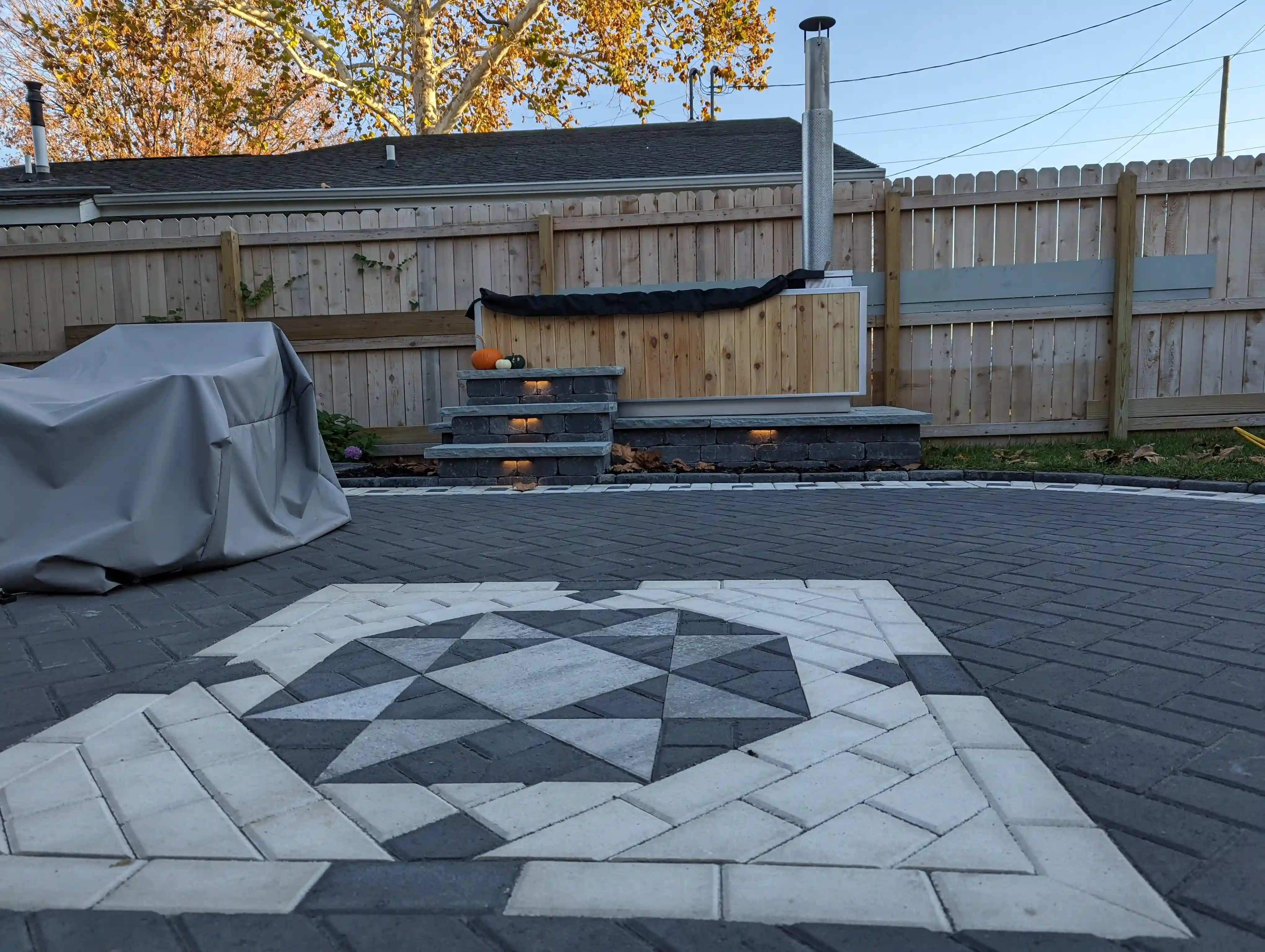 paver patio with interesting pattern in the middle