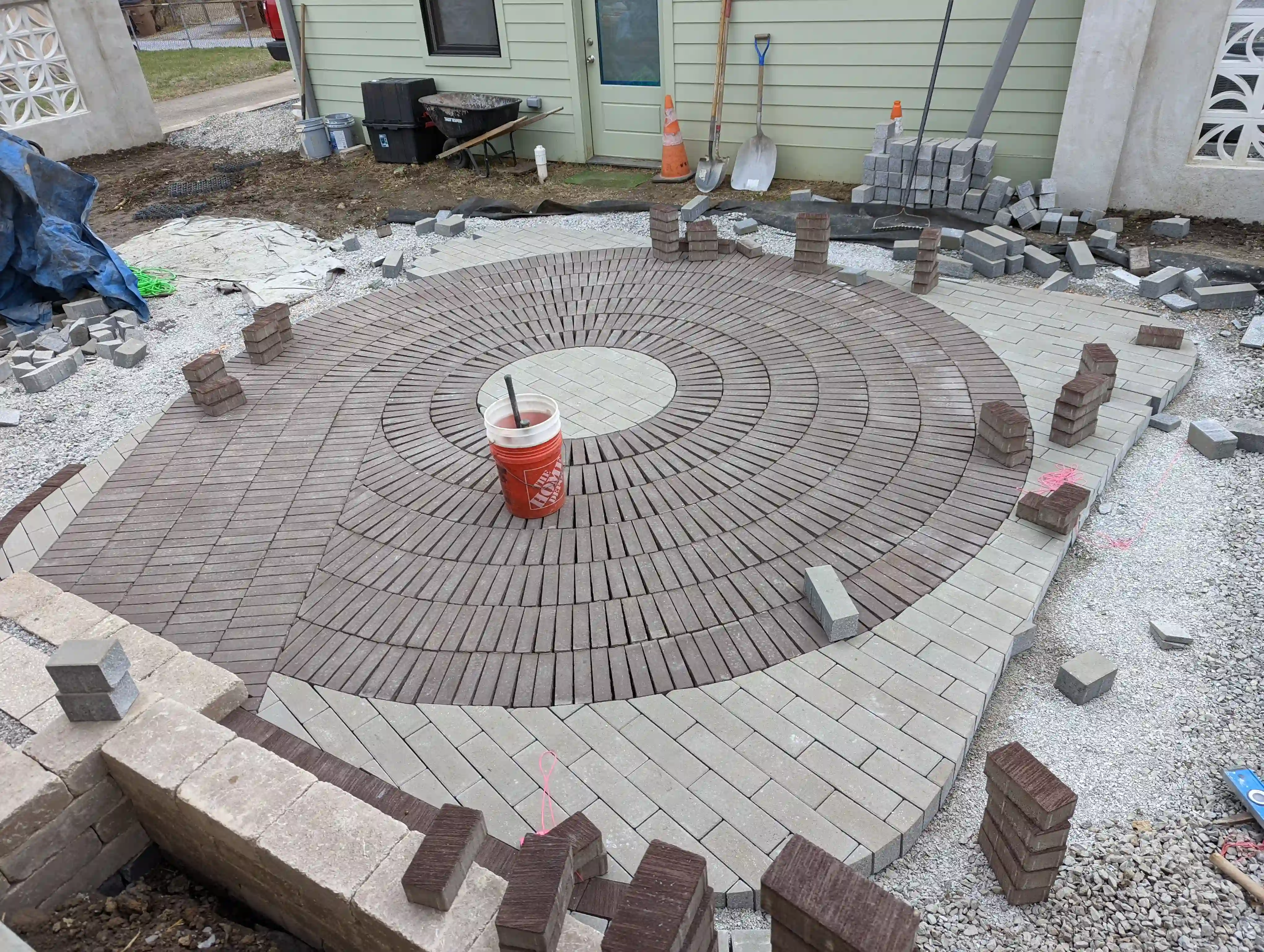 concentric circle paver patio being laid