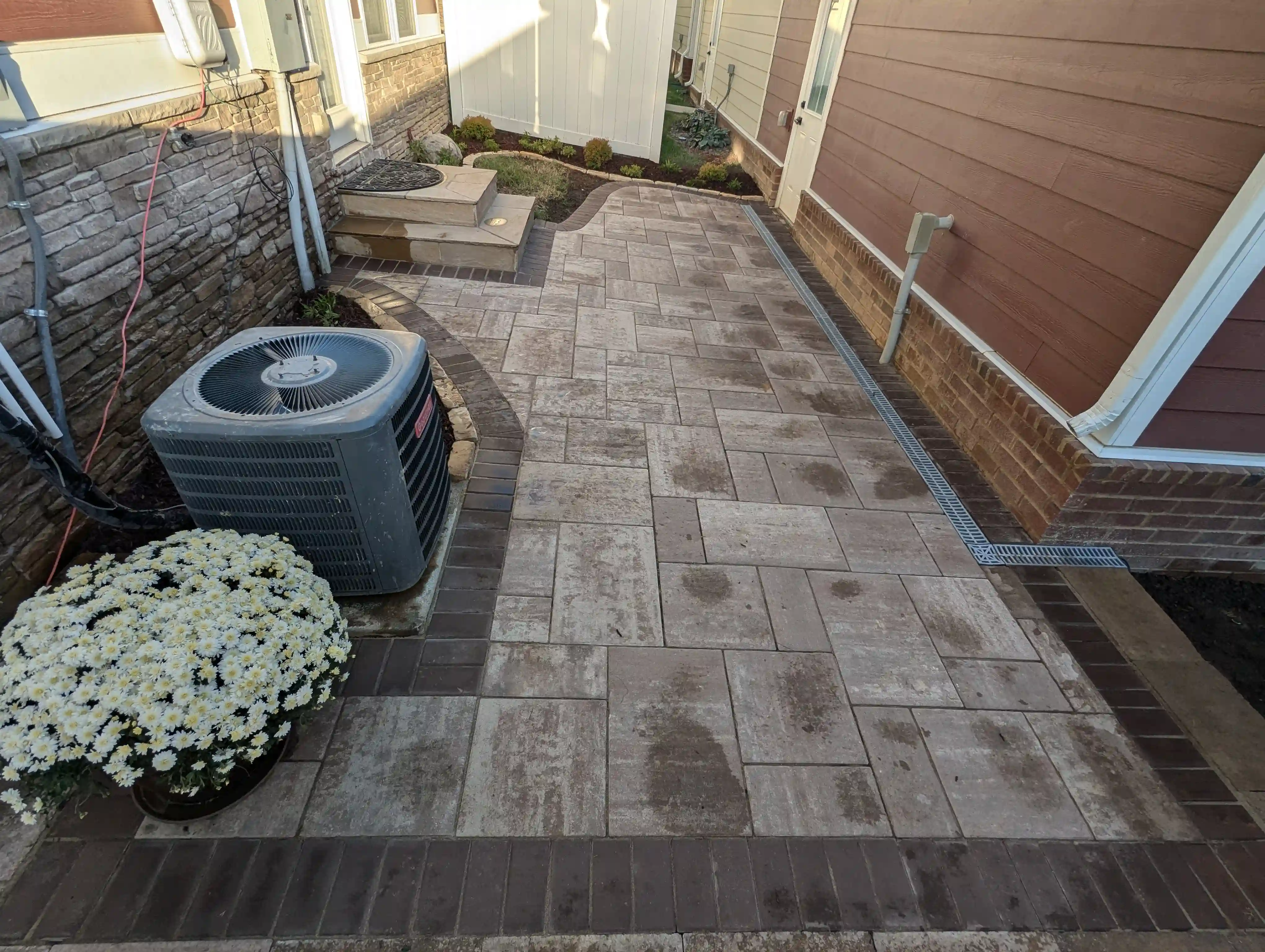 aerial overview of a back patio made from large and small paver stones