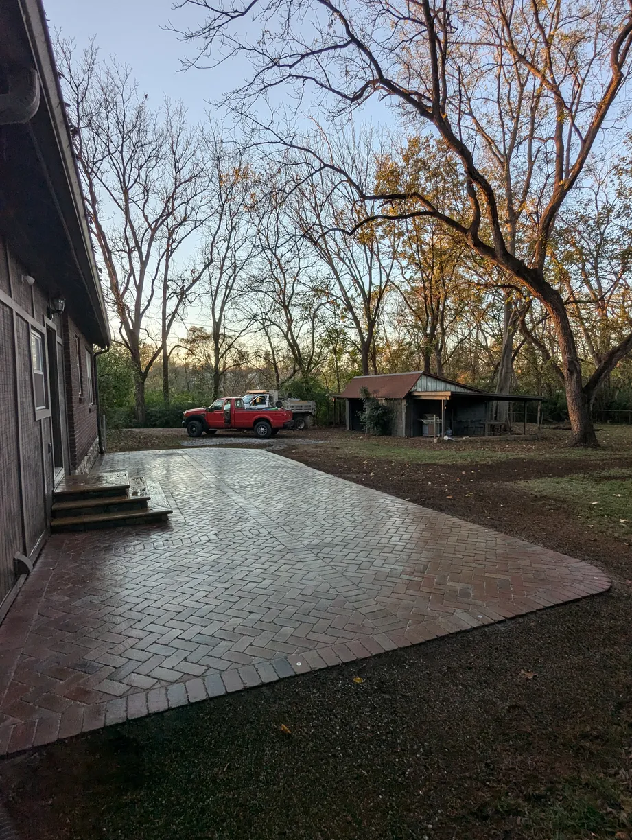 red brick paver patio with small bricks in a rural area