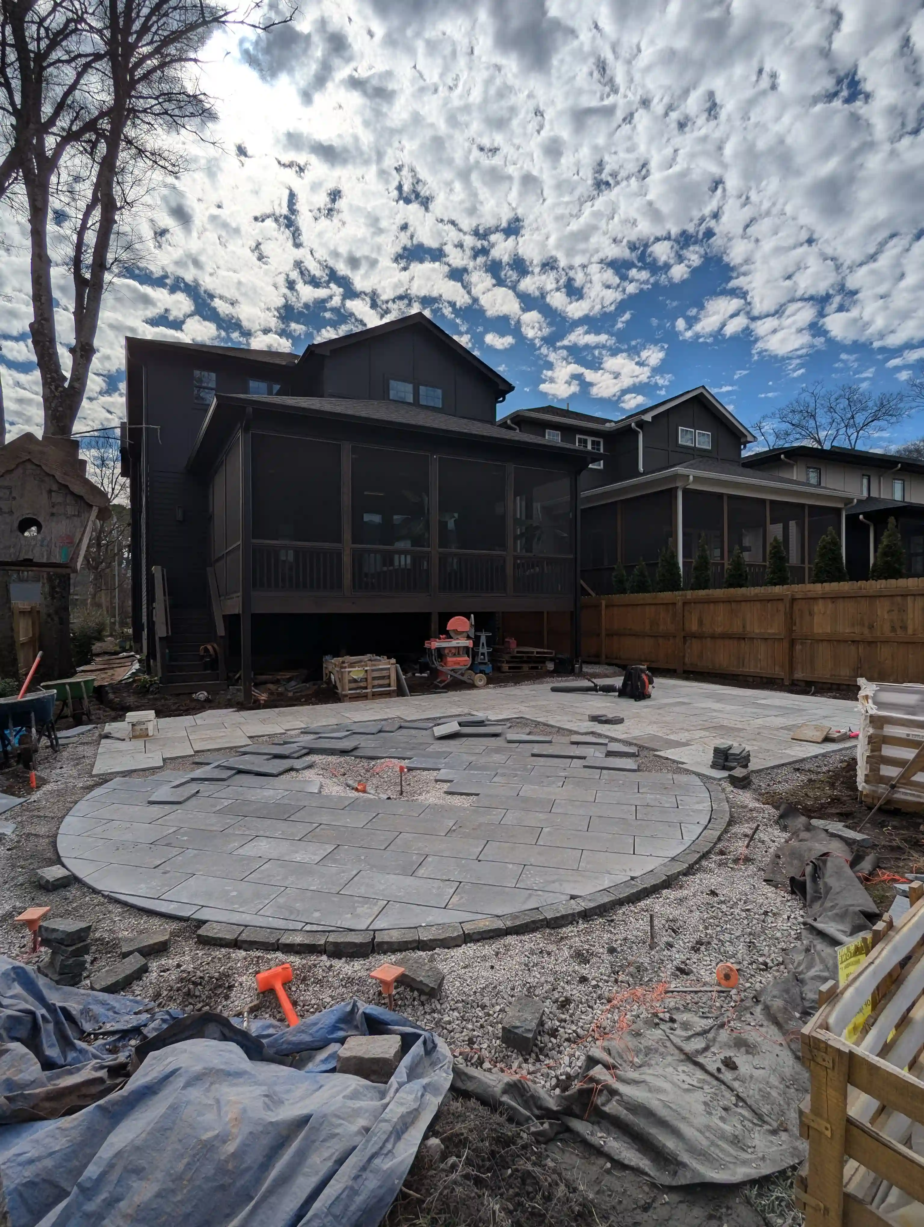 progress picture of a rounded paver patio being laid