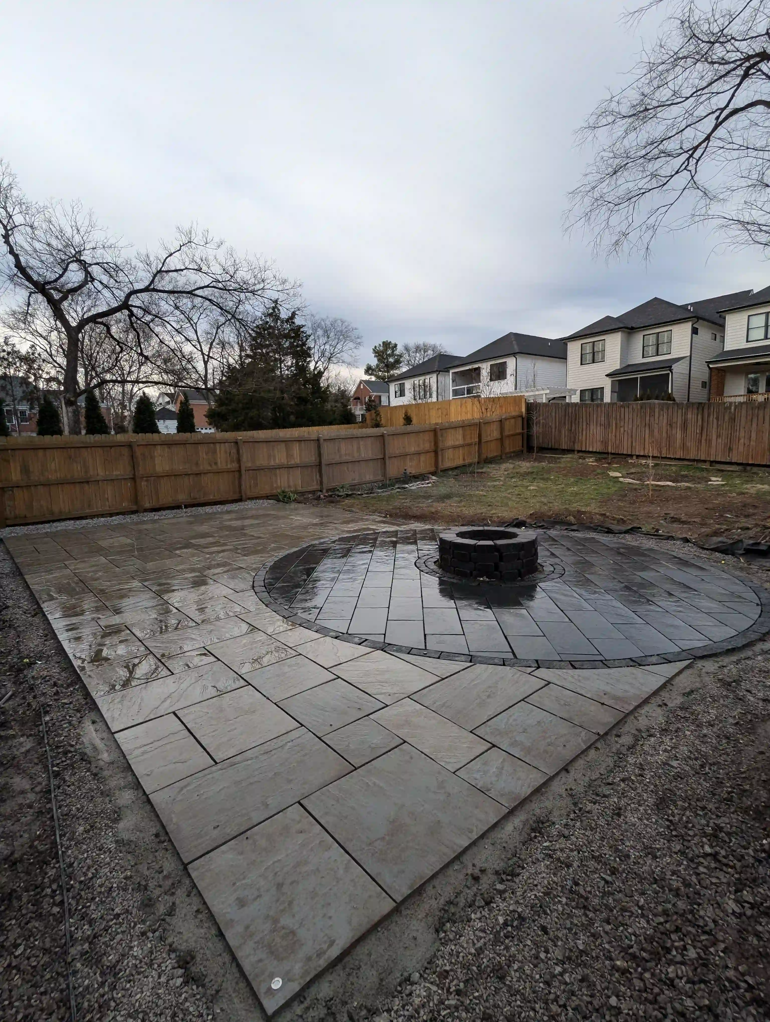 rectangle paver patio with small circular paver patio inside