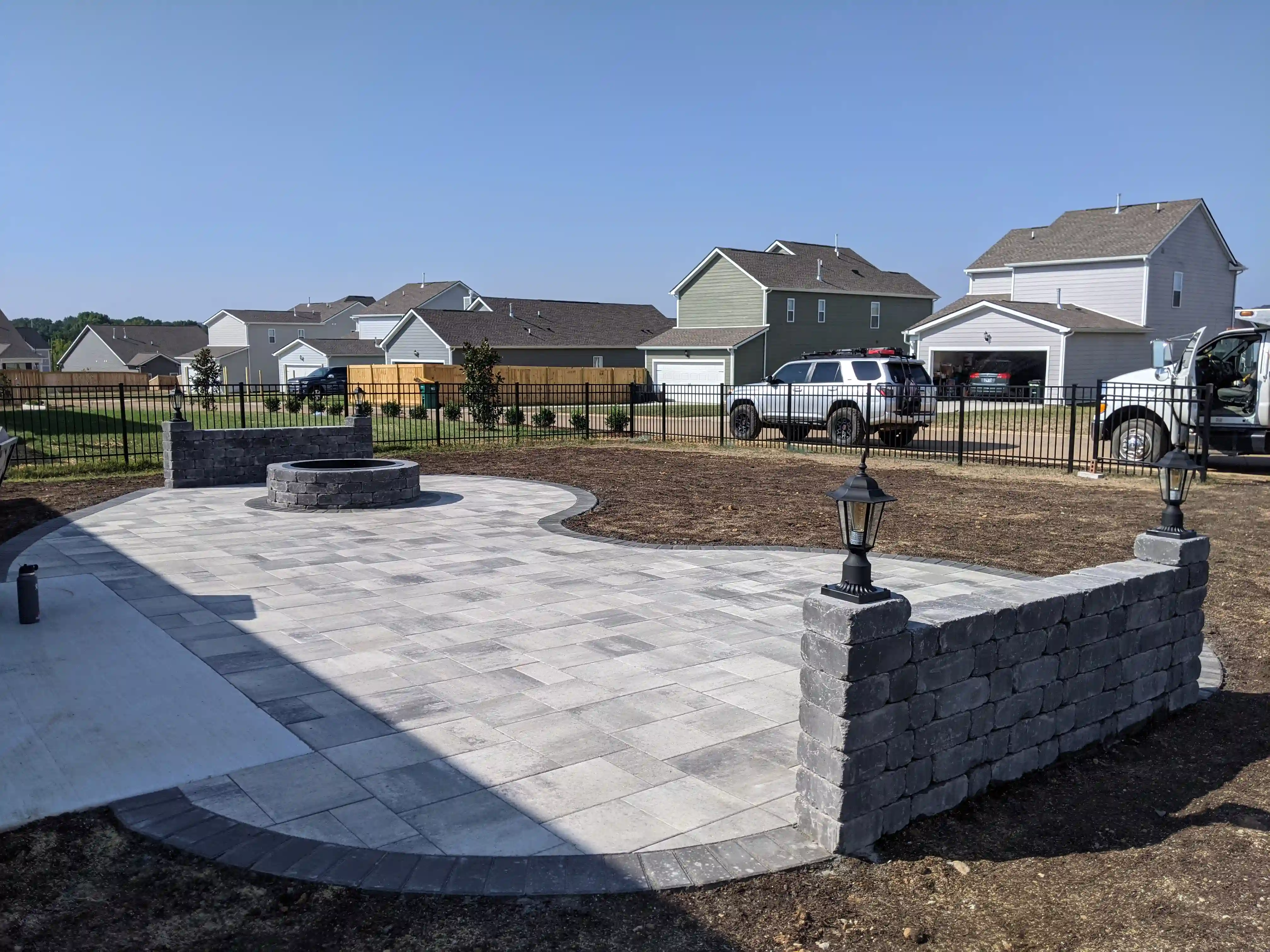 clean stone patio in the backyard of a suburban home
