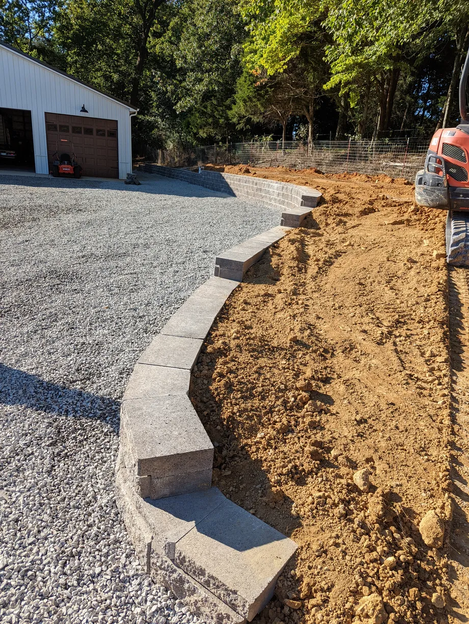 cinderblock large brick retaining wall to separate driveway